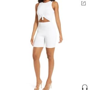 naked wardrobe front cutout romper in white size medium.